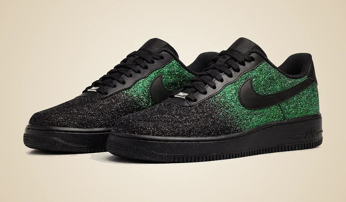 Emerald Bling bespoke sneaker pair, a black leather upper fading into emerald glitter, three-quarter editorial product study